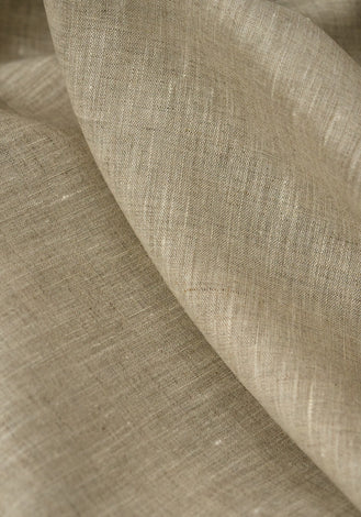 Close-up of beige fabric with a textured pattern